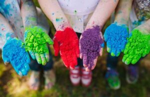 5 Fascinating Indian Festivals: A Guide to India’s Colorful Celebrations kids hands with holi powder colors